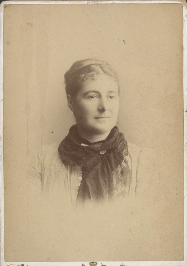 Albumen silver cabinet photograph of Harriet taken in the studio of Claremont & Co. Melbourne between 1889 and 1898. The reverse contains a signature and dedication to Miss Moon.